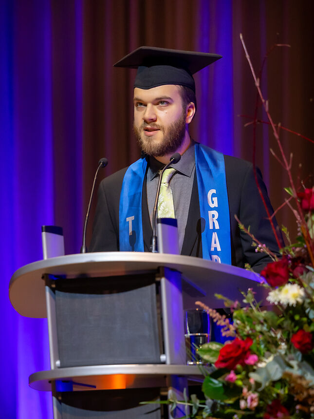 a young man holding a speech