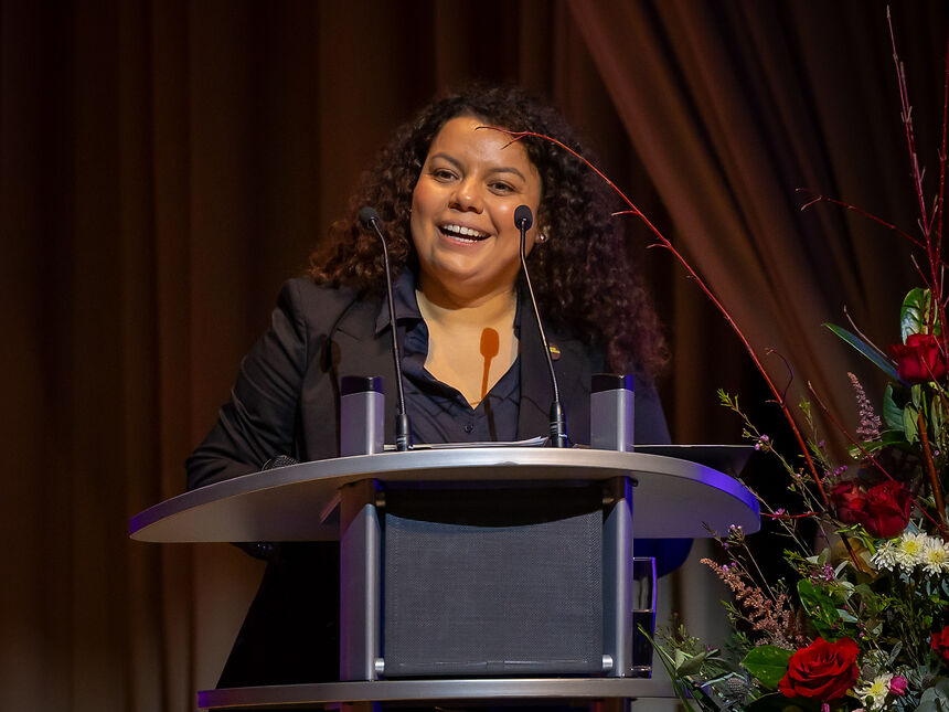 a woman holding a speech