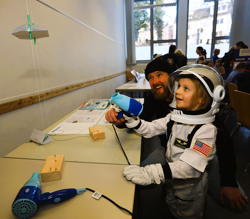 a child in an astronaut costume