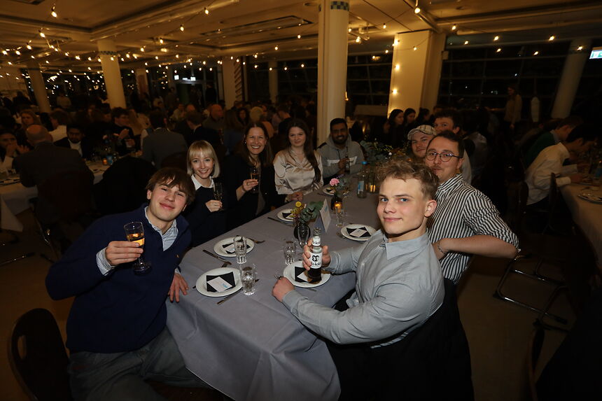 young people sitting at a table